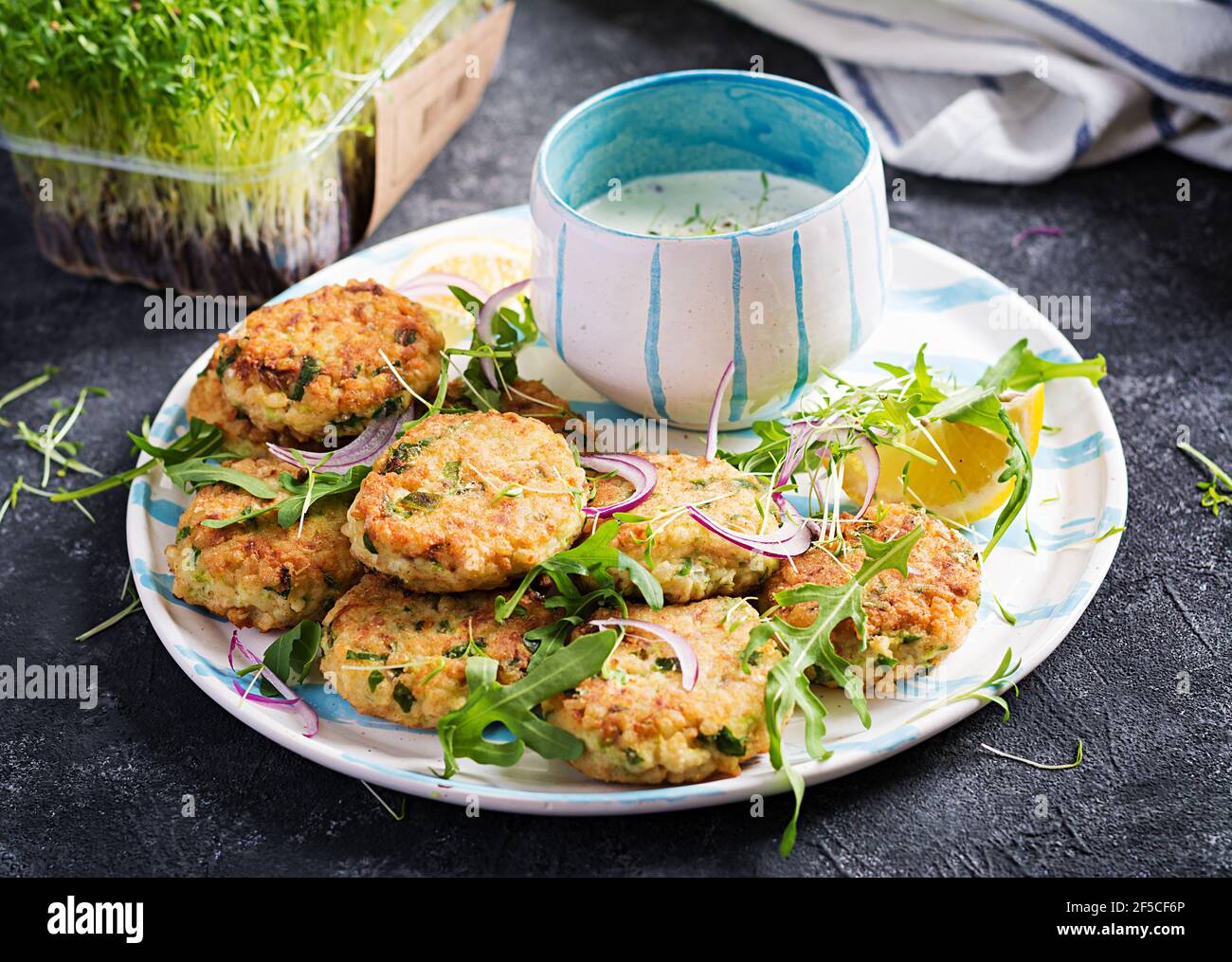 Homemade fish croquette with white fish, bulgur, spinach and breadcrumbs. Fritters from minced cod. Stock Photo