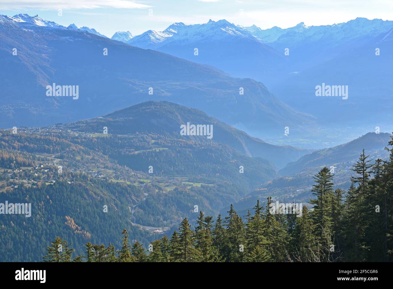 Mist in the valleys of the Southern Swiss Alps around the Rhone Valley Stock Photo