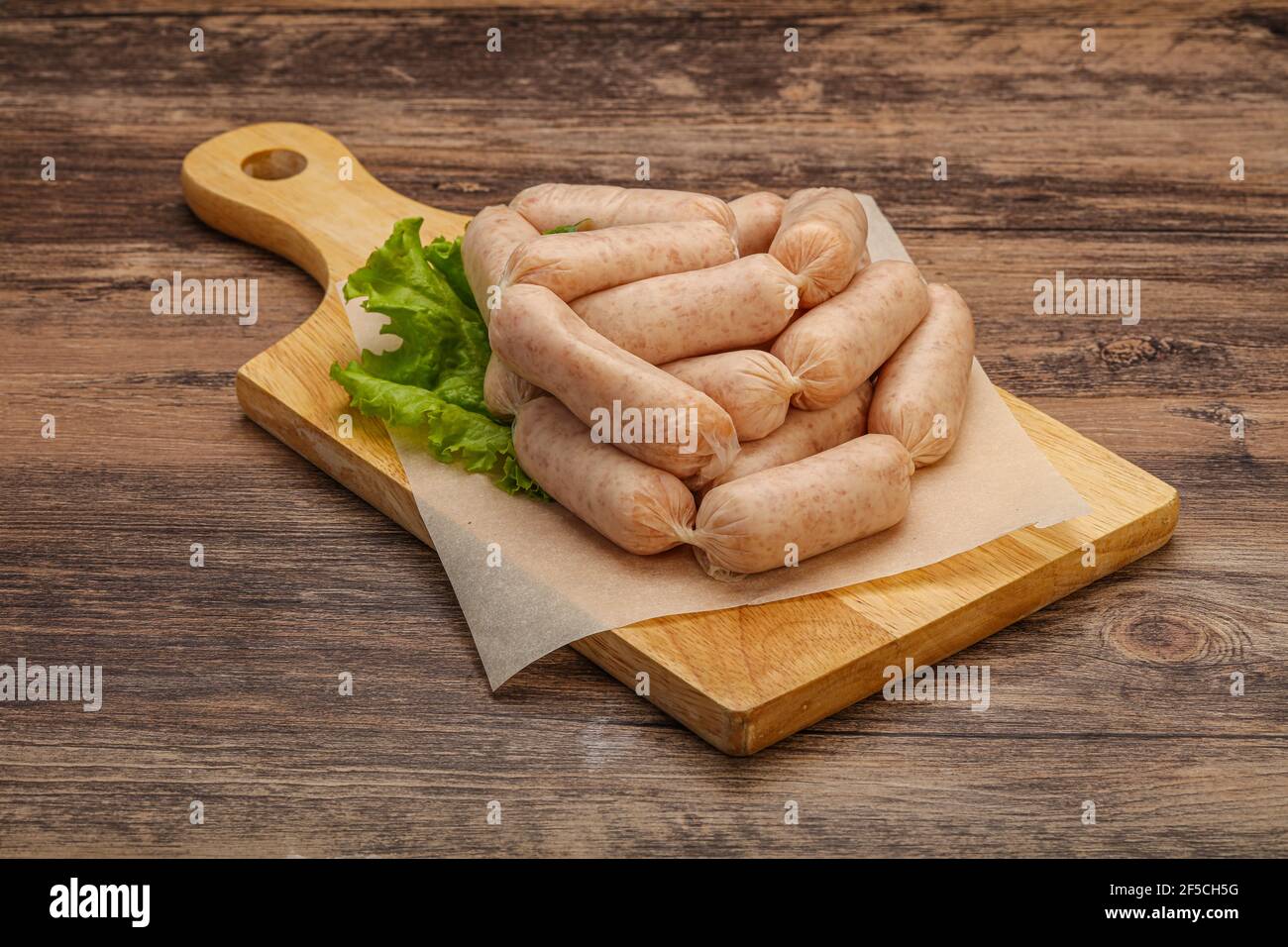 Raw natural chicken baby sausages for roast Stock Photo Alamy