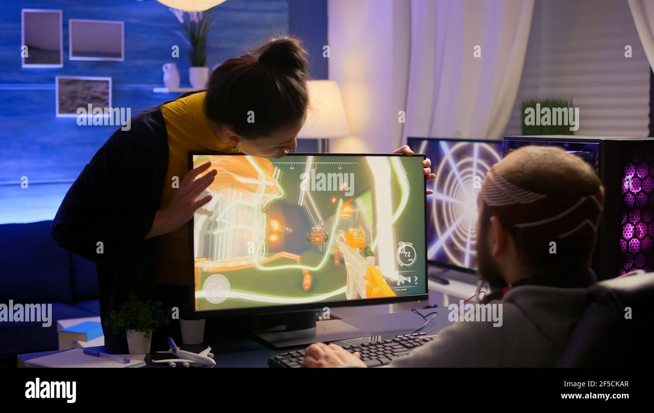 Cyber gamer fight with girlfriend about playing first person shooter video  game for online competition. Pro player performing on powerful pc in gaming  room home during online tournament Stock Photo - Alamy