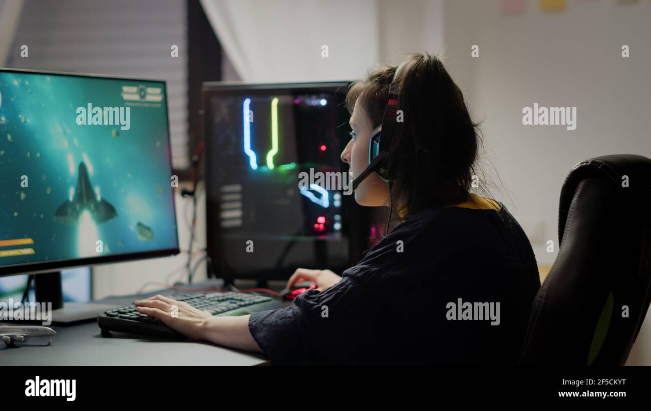 Professional pro gamer playing space shooter video game new graphics on  powerful computer from home. Virtual shooter game in cyberspace, esports  player performing on pc gaming tournament Stock Photo - Alamy