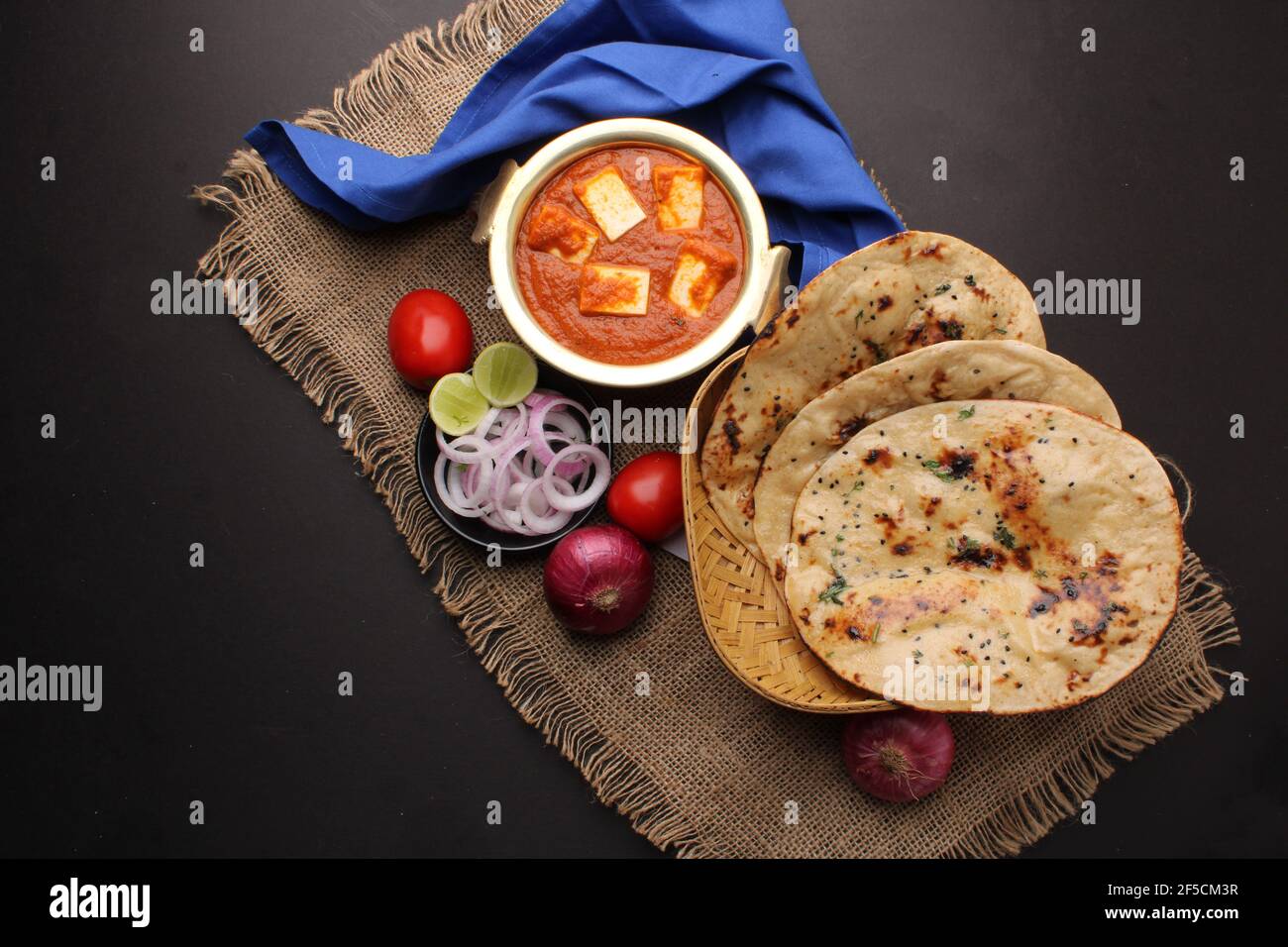 Paneer Butter Masala or Cheese Cottage Curry in serving a bowl or pan