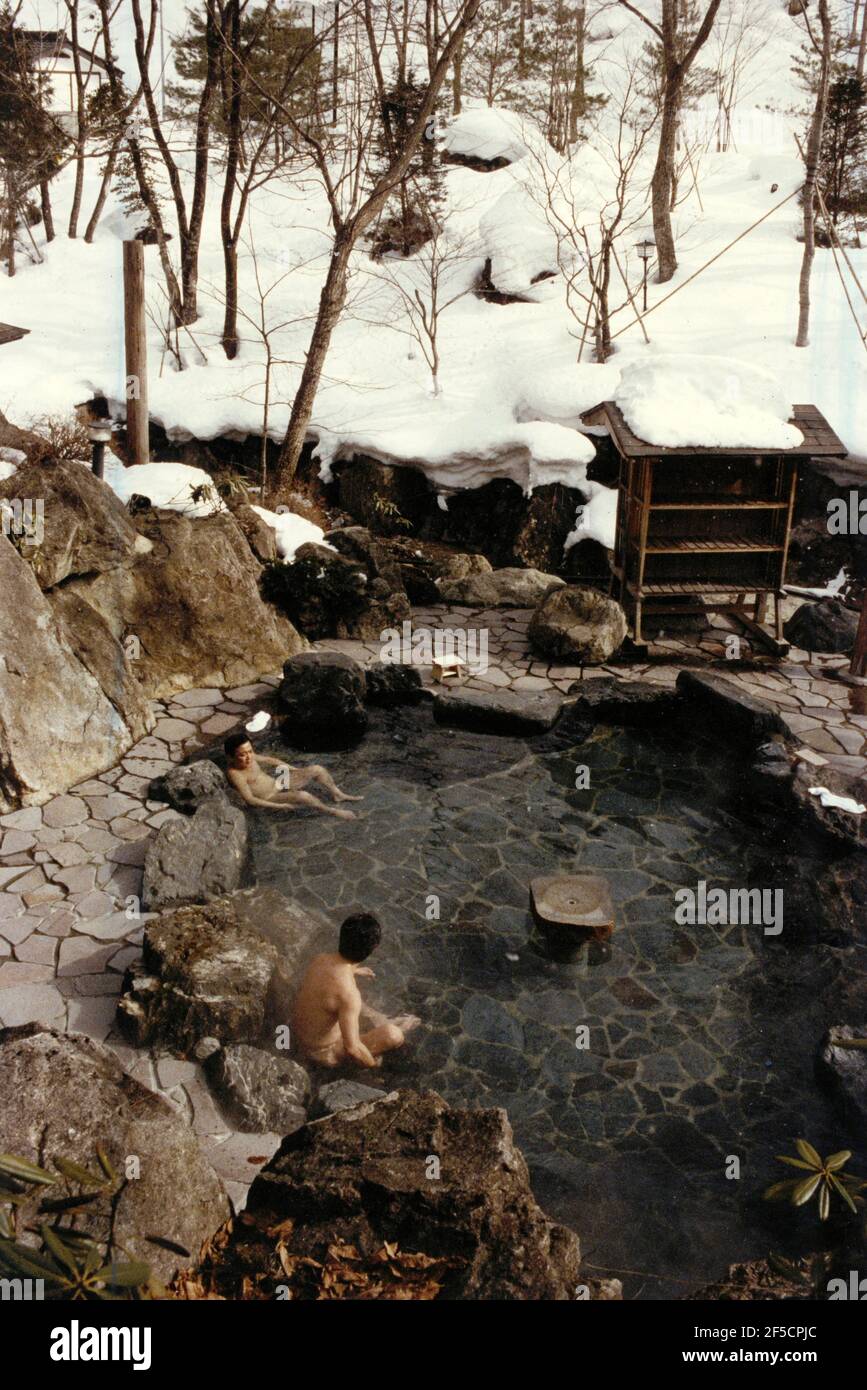 1991-03-22 Hot springs up in the snow-capped mountains, the quintessential essence of the traditional Japanese bath culture. Two men  relaxing in an outdoor hot spring bath.  Photo: Ake Malmstrom / DN / TT / Code: 37 Stock Photo