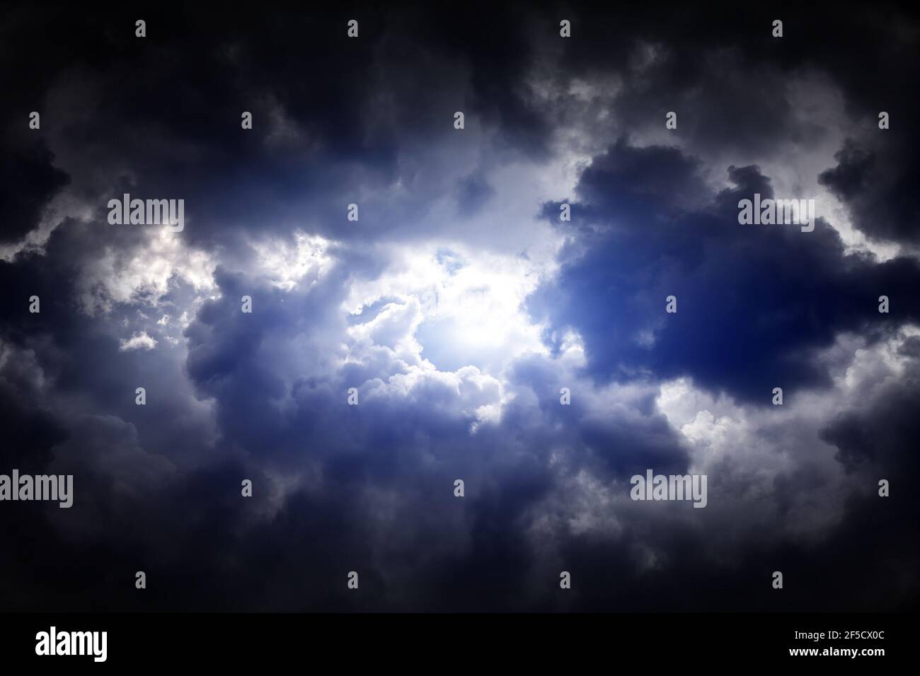 Light in the Dark and Dramatic Storm Clouds Stock Photo - Alamy