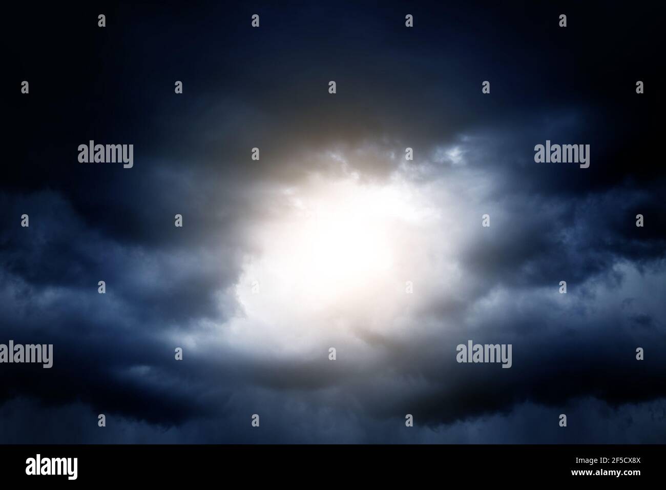 Light in the Dark and Dramatic Storm Clouds Stock Photo - Alamy