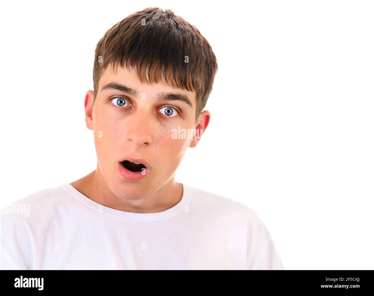 Surprised Young Man on the White Background closeup Stock Photo
