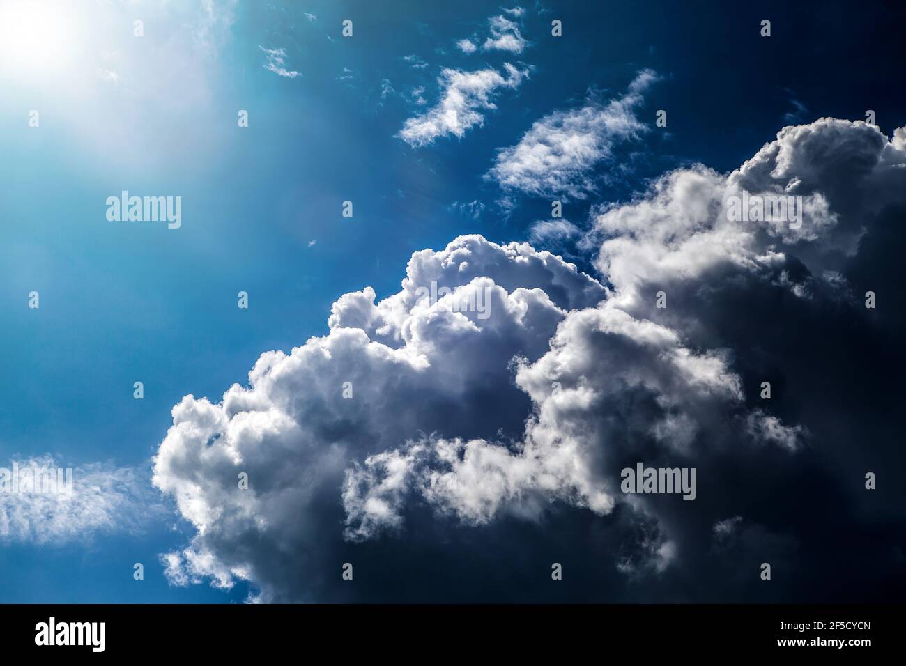 Cloudscape Background with Sun and Blue Sky Stock Photo - Alamy