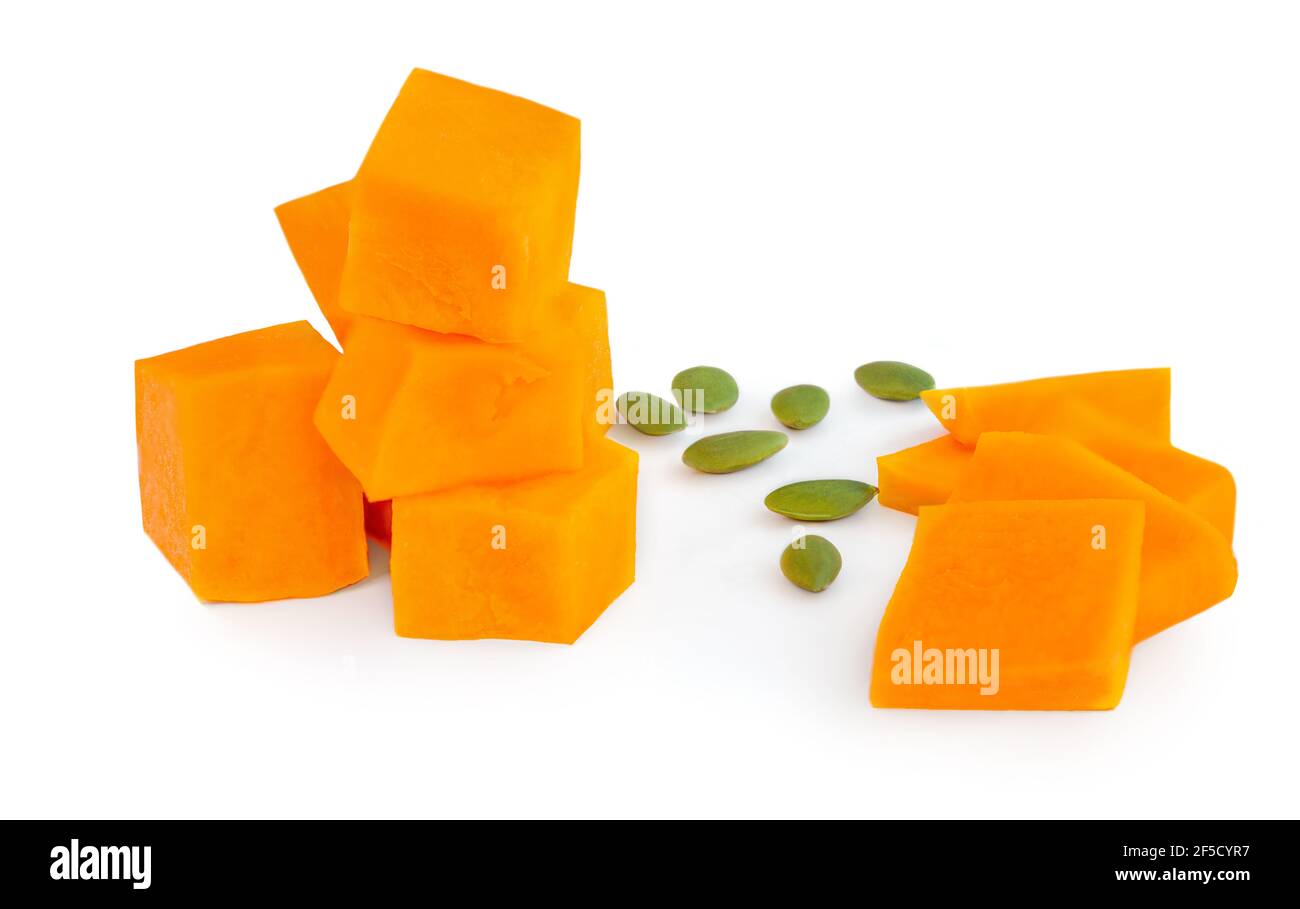 Pumpkin pieces cut in a cube chunks isolated on white background Stock ...