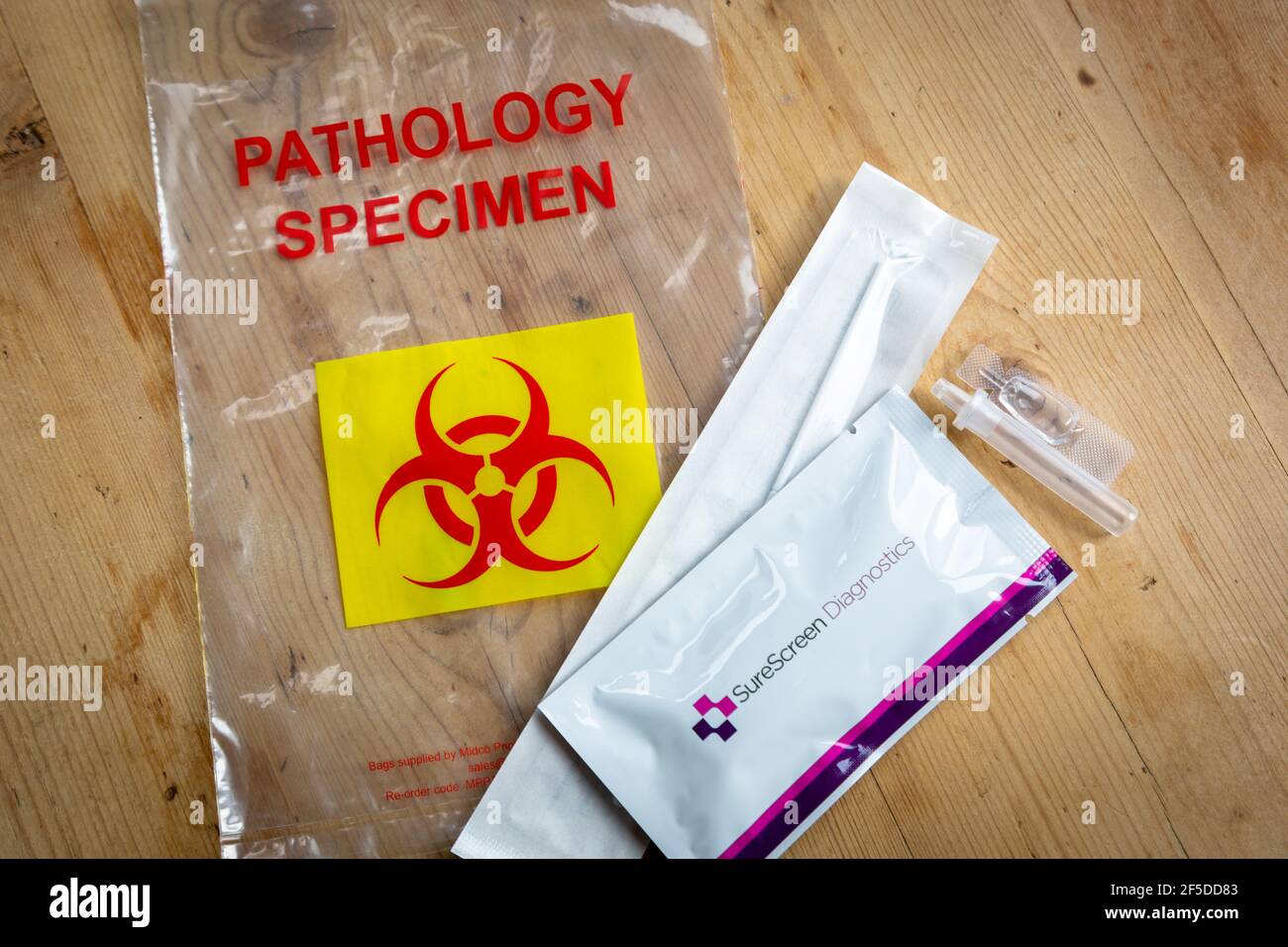 Lateral flow Covid-19 test kit and its components Stock Photo