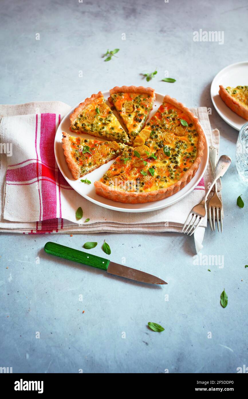 Salty cake with peas and vegetables Stock Photo