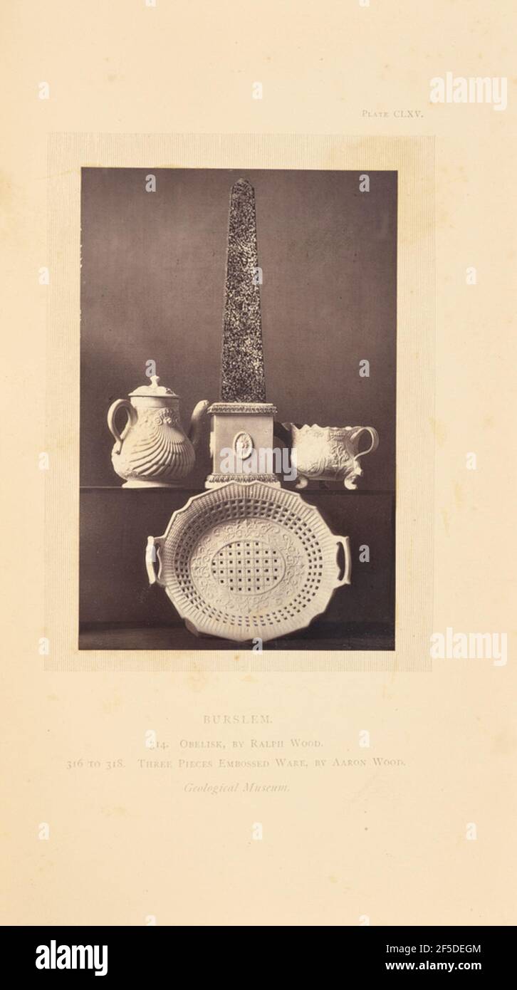 Obelisk, tea pot, milk pot, and plate. An obelisk between a tea pot and a milk pot on a shelf above a plate. The tea pot, milk pot, and plate are companion pieces and are decorated with shells, flowers, and scrolling patterns in relief. The plate is also decorated with a perforated grid pattern.. (Recto, mount) upper right, printed in black ink: 'PLATE CLXV.' Lower center, printed in black ink: 'BURSLEM. / 314. OBELISK, BY RALPH WOOD. / 316 TO 318. THREE PIECES EMBOSSED WARE, BY AARON WOOD. / Geological Museum. italicized' Stock Photo