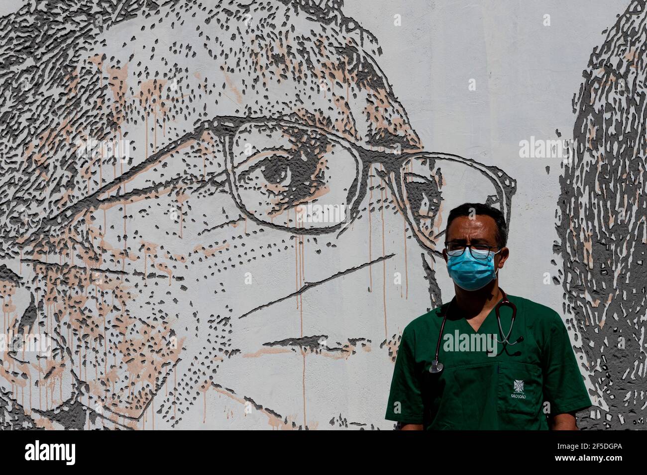 David Andrade Doctor Poses In Front Of His Portrait By Vhils A Famous 