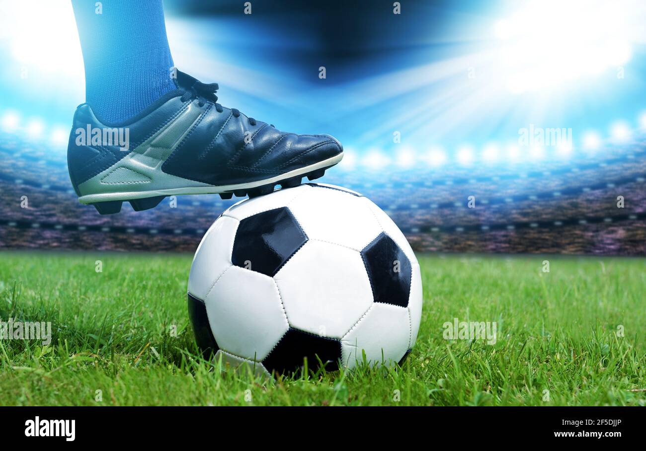 Feet of soccer player with ball on football field Stock Photo Alamy