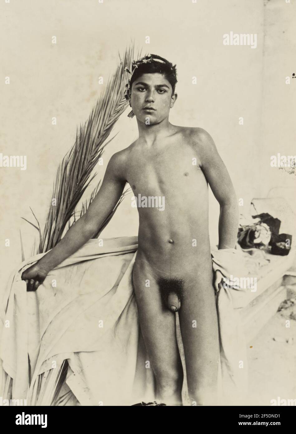 Boy with palm frond. Baron Wilhelm von Gloeden (German, 1856 - 1931) Stock Photo