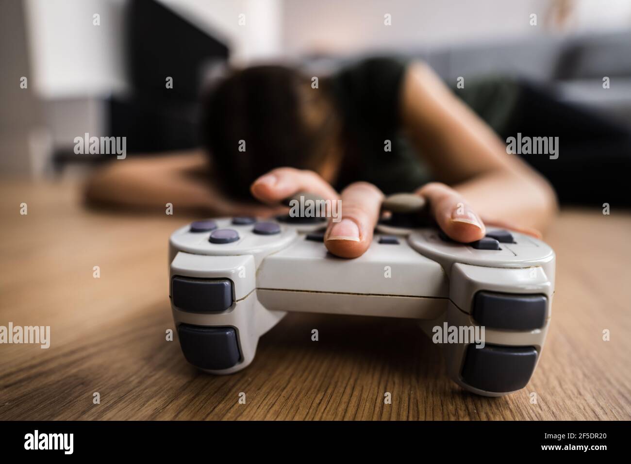 Female Gaming Addiction. Player With Console Controller Stock Photo