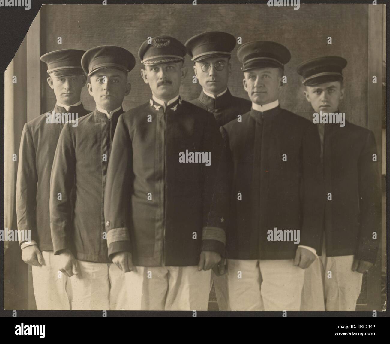 Group of Young Men in Uniform Before Tapestry (Cadets?). Louis