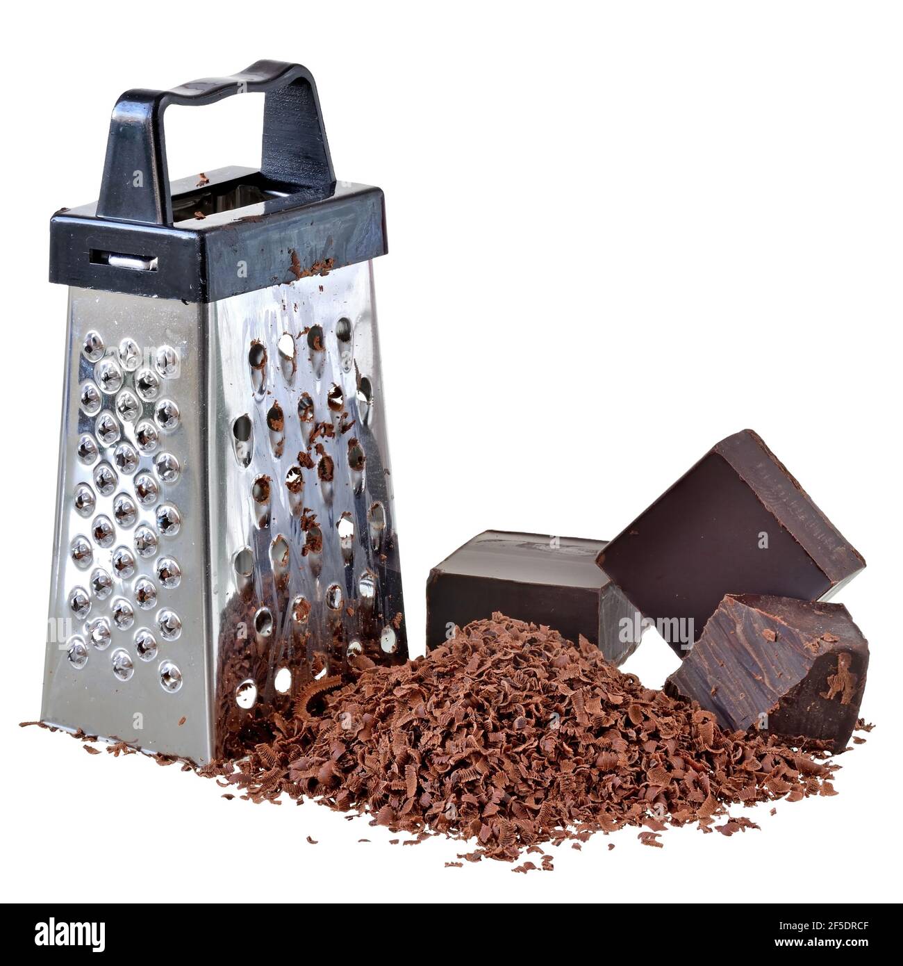 Grated chocolate and cube of bitter chocolate with a mini grater