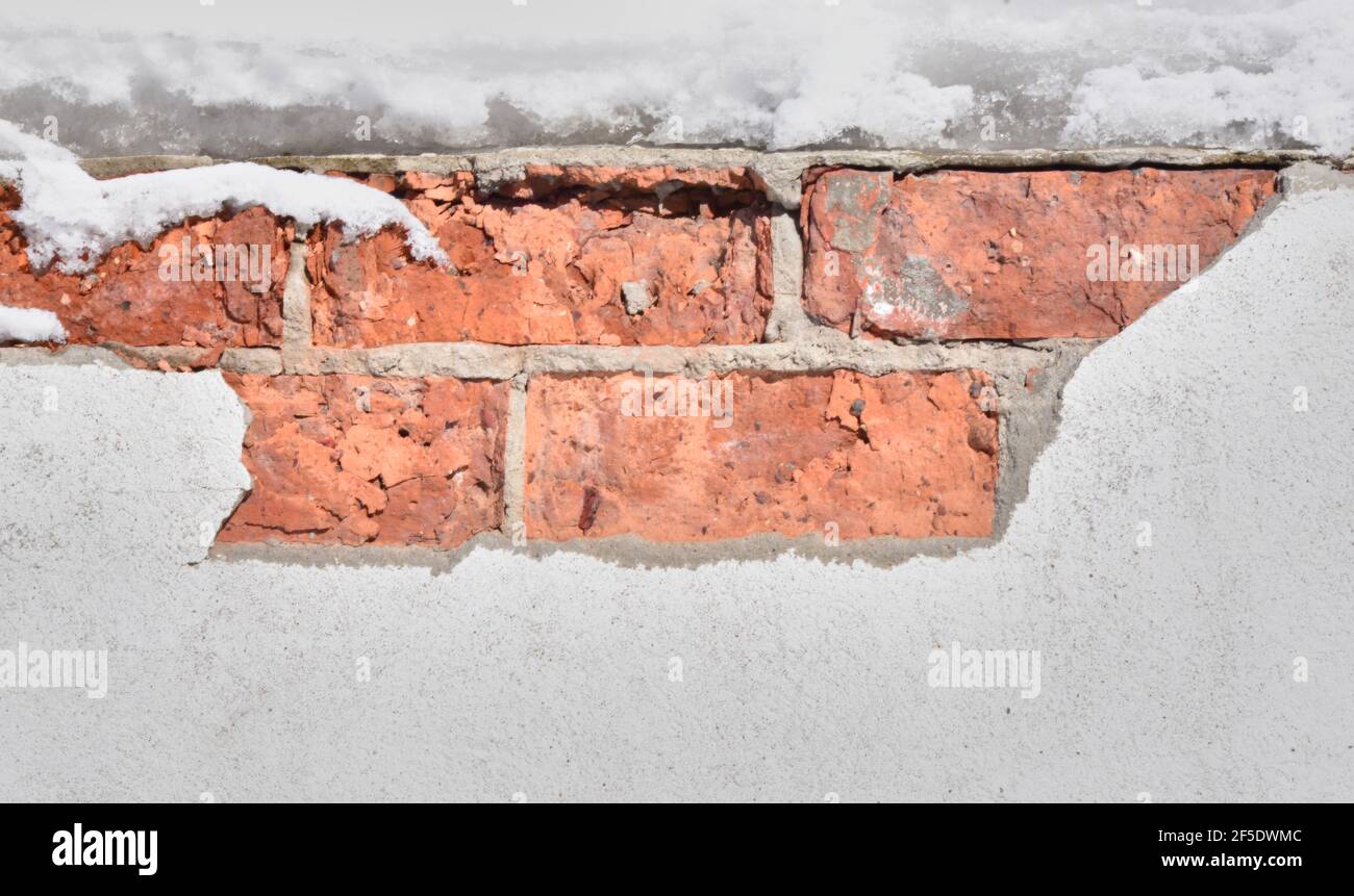 part of a brick wall under plaster Stock Photo Alamy