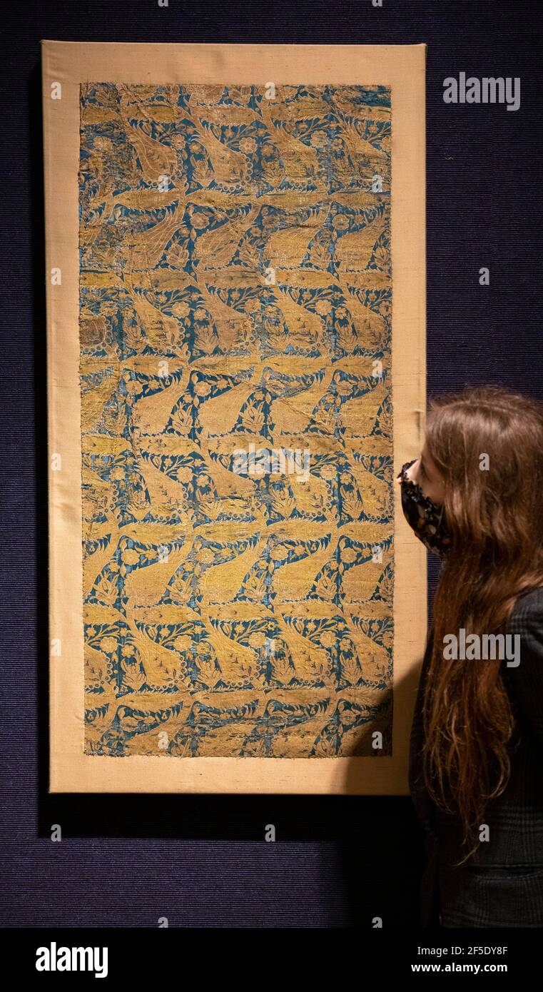Bonhams, London, UK. 26 March 2021. Preparations for Bonhams spring sale of Islamic and Indian Art on 30 March includes An Ottoman Silk Lampas and Gold Thread Panel (Khema), Turkey, 17th Century, estimate: £5,000-7,000. Credit: Malcolm Park/Alamy Live News Stock Photo