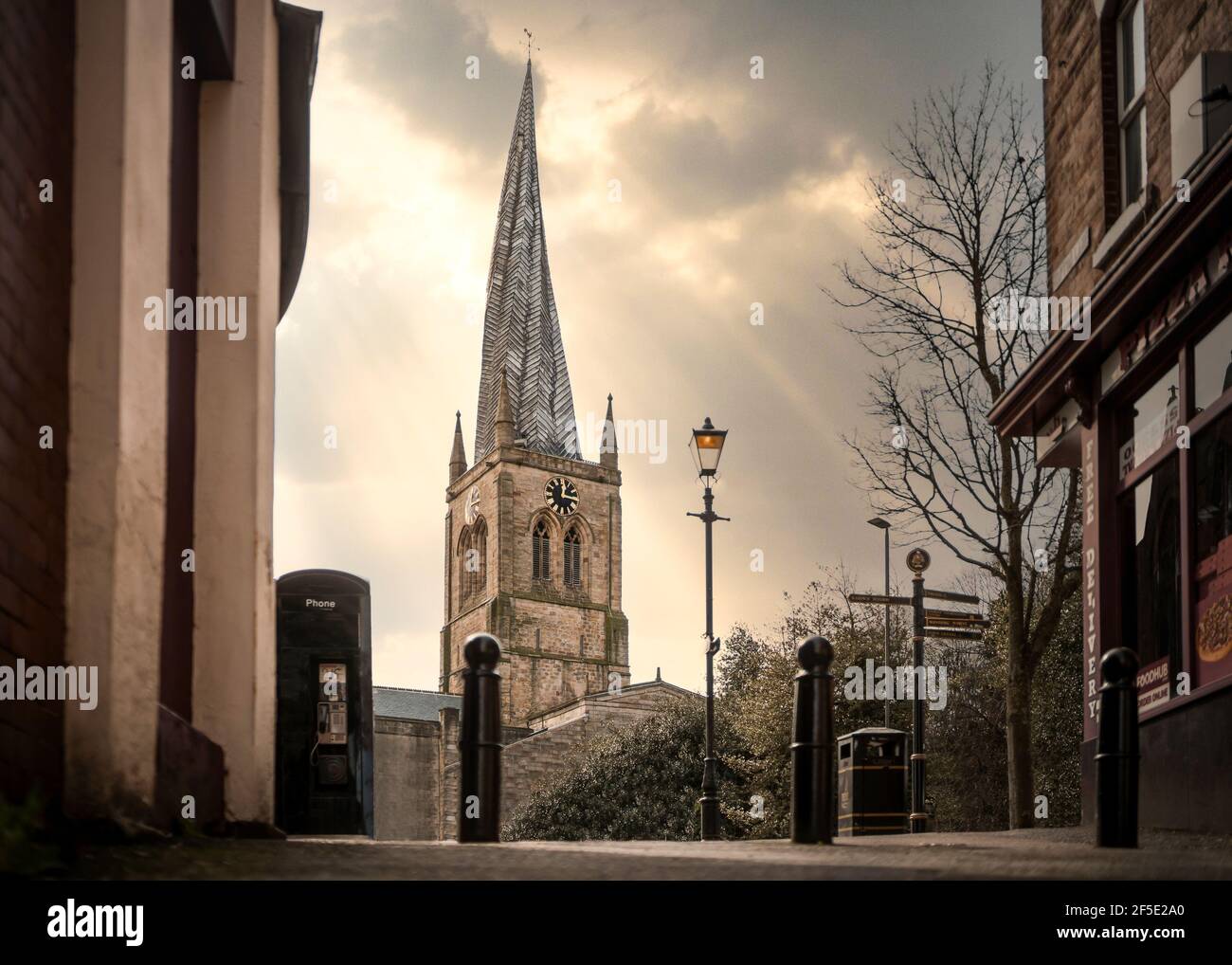 The Crooked Spire Church of St Marys all saints golden hour sunset in Chesterfield market town Derbyshire spring summer day famous twisted steeple Stock Photo