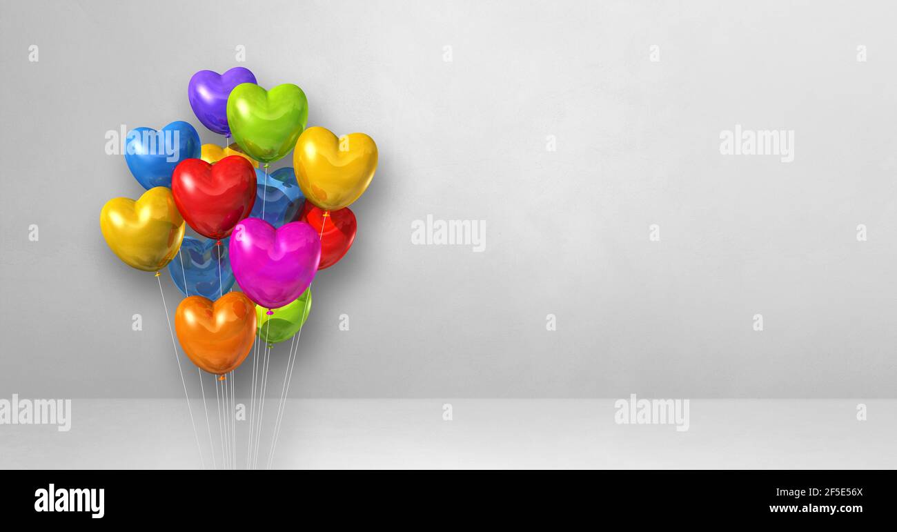 Colorful heart shape balloons bunch on a white wall background ...