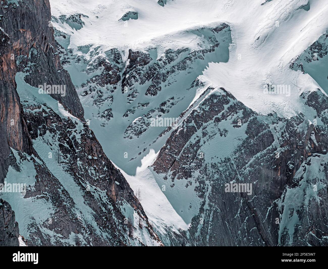 Beautiful alpine snow covered peaks in the mountain village of Les Diableret in Switzerland. Stock Photo