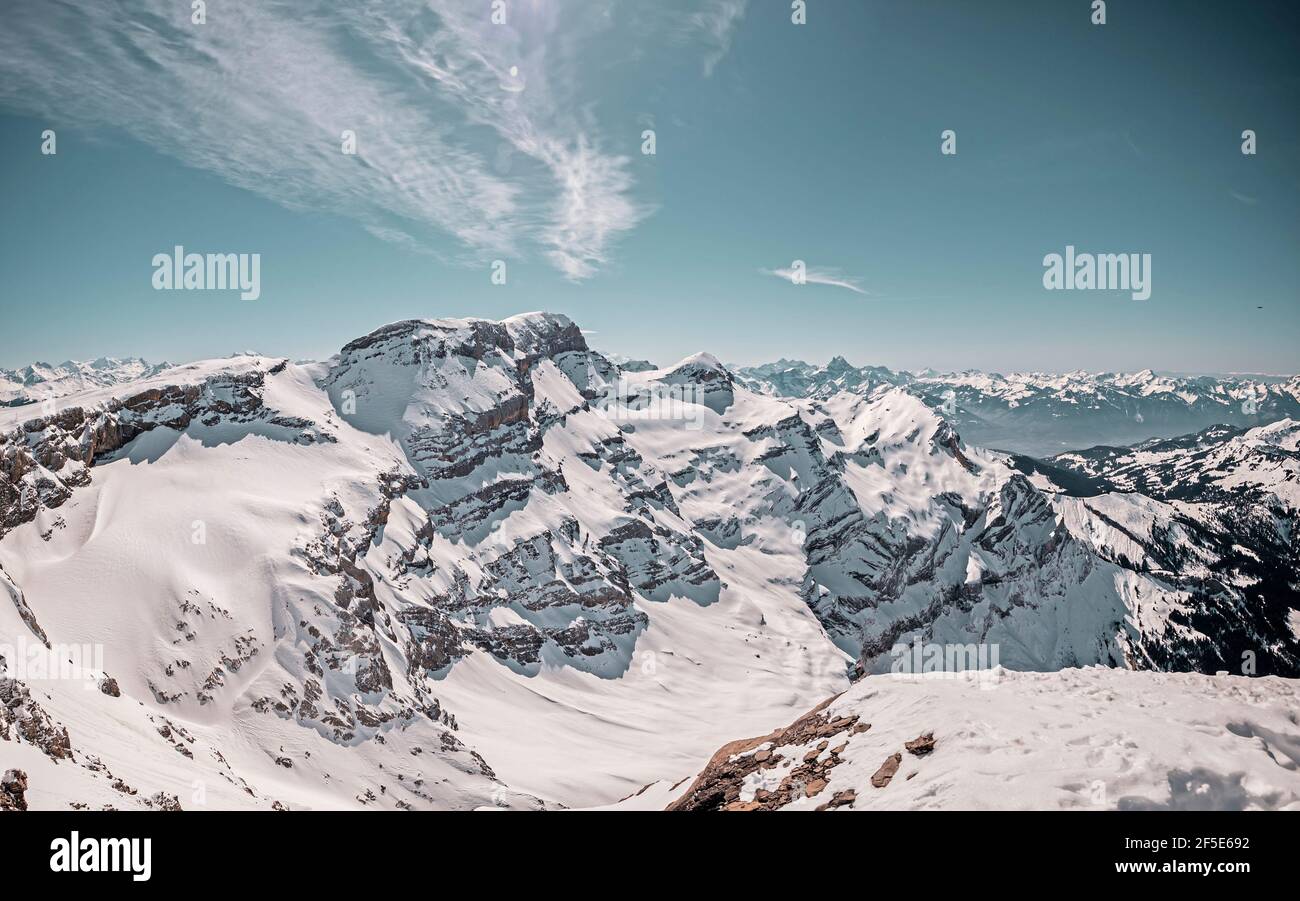 Beautiful alpine snow covered peaks in the mountain village of Les Diableret in Switzerland. Stock Photo