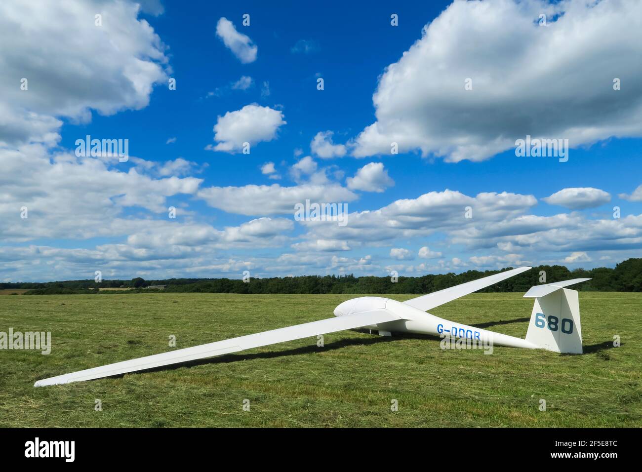 Glider awaiting retrieval on Russells Water Common in the Chiltern Hills near Henley-on-Thames; Maidensgrove, Oxfordshire, UK Stock Photo