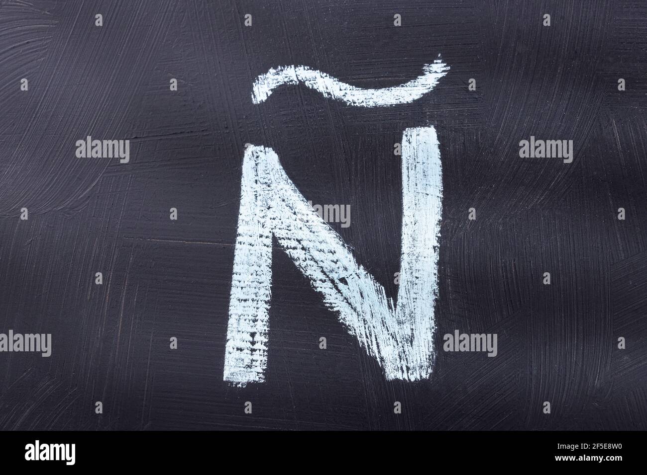 Letter Ñ of the alphabet written with chalk Stock Photo - Alamy