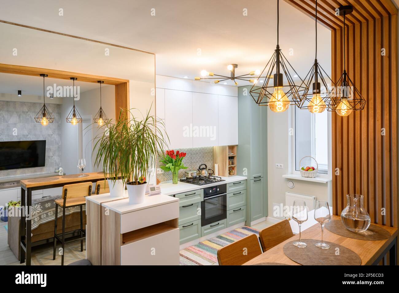 Modern classic white kitchen interior with dining zone Stock Photo - Alamy