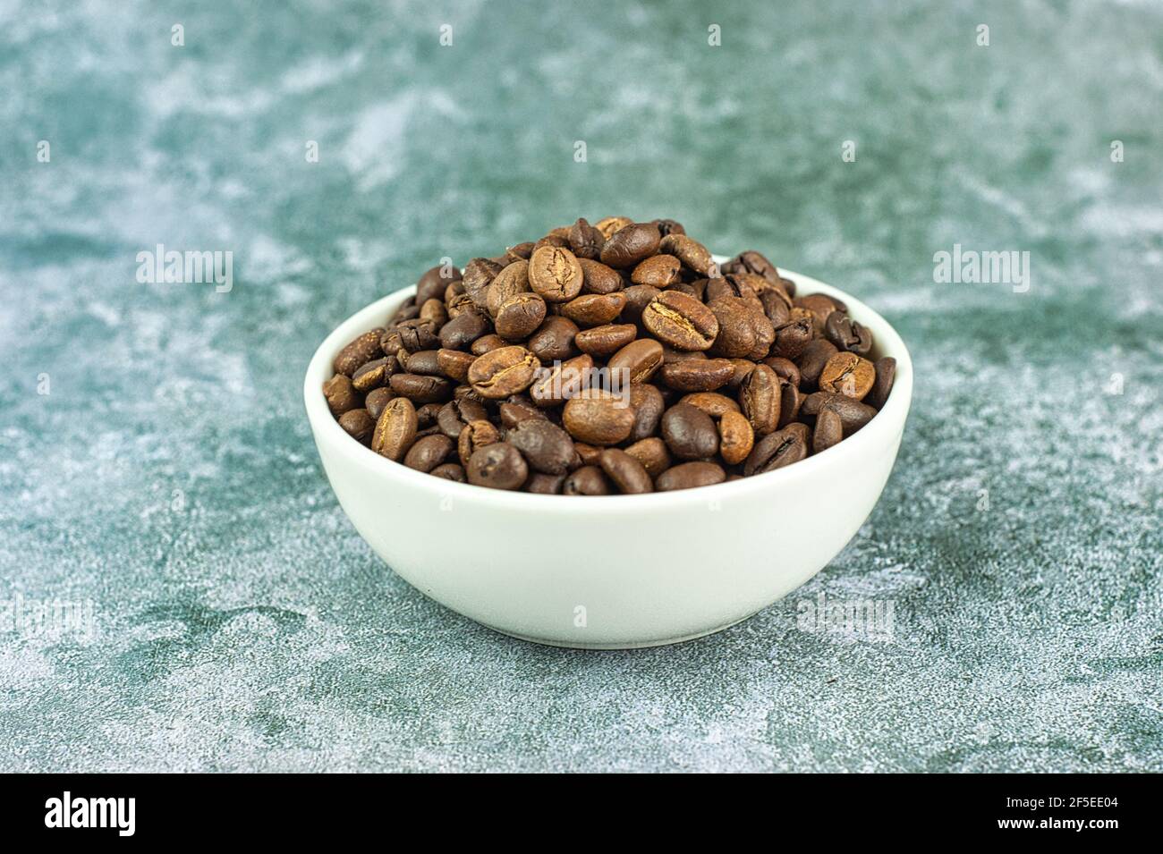 Pot of roasted coffee beans Stock Photo
