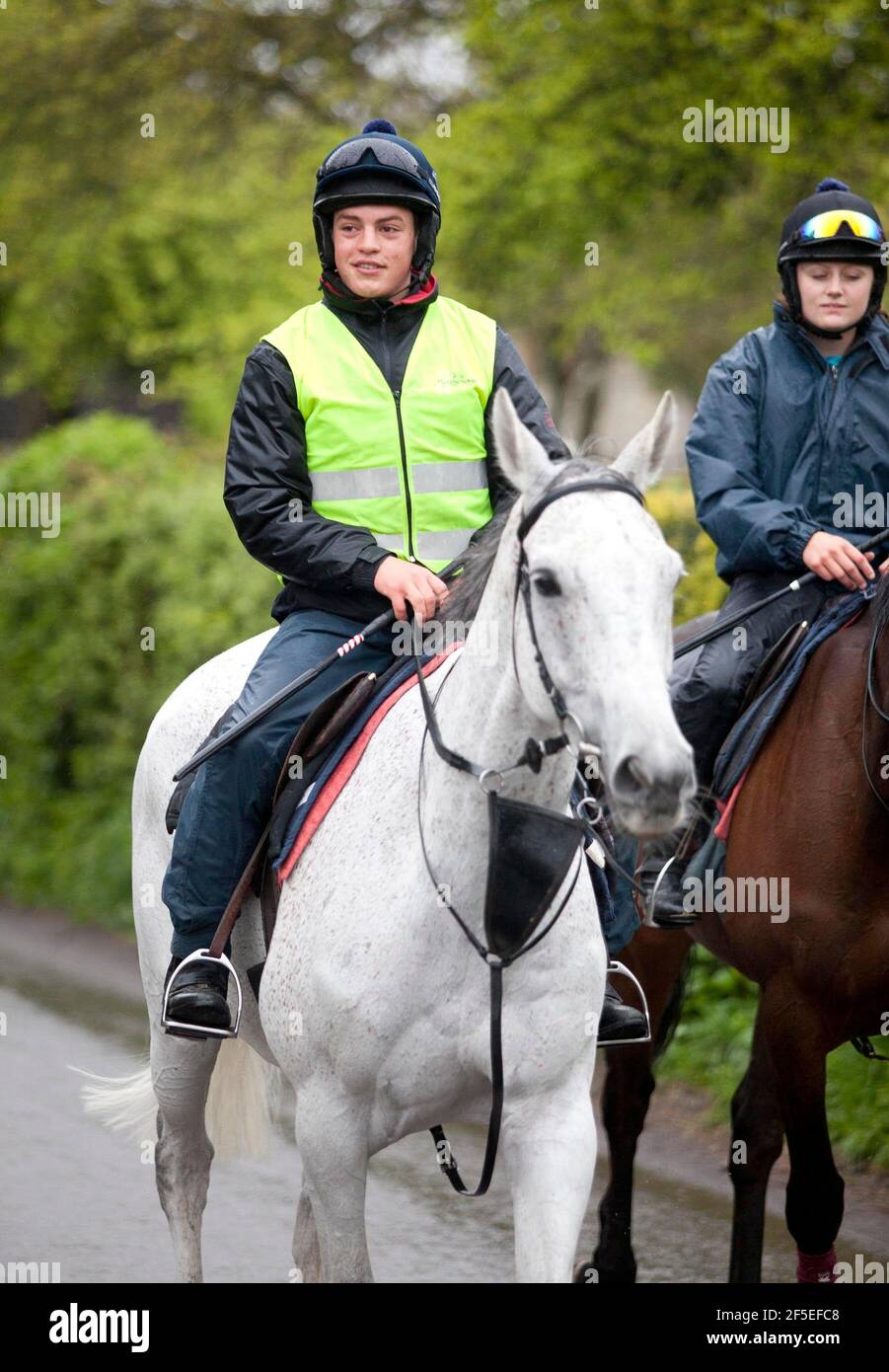 Grand National winner Neptune Collonge with his training rider Billy Page at Paul Nicholls stables in Ditcheat, Somerset. Stock Photo