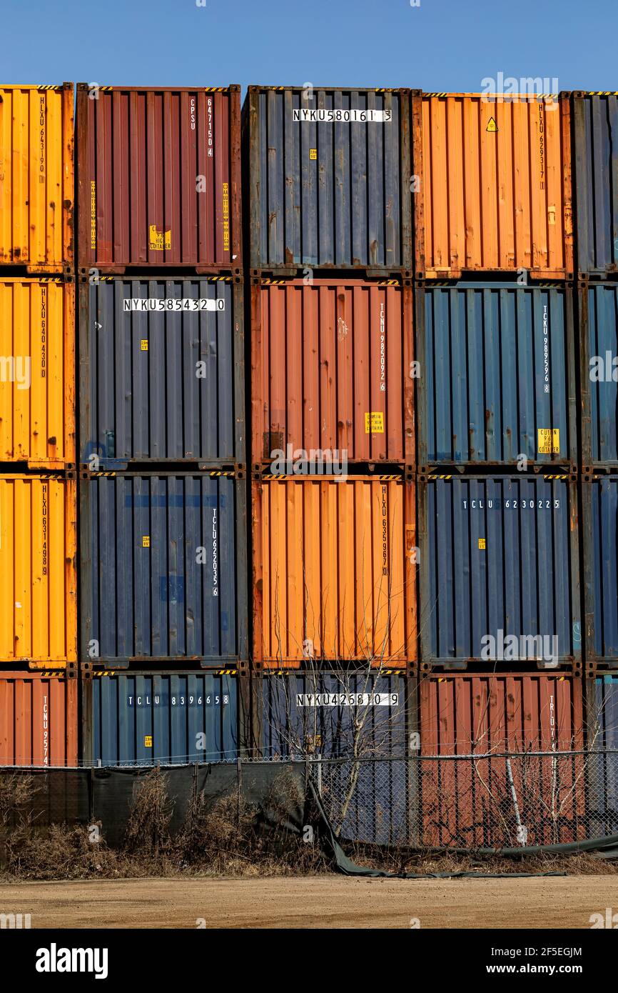 Shipping containers stacked at a port container terminal. Ontario