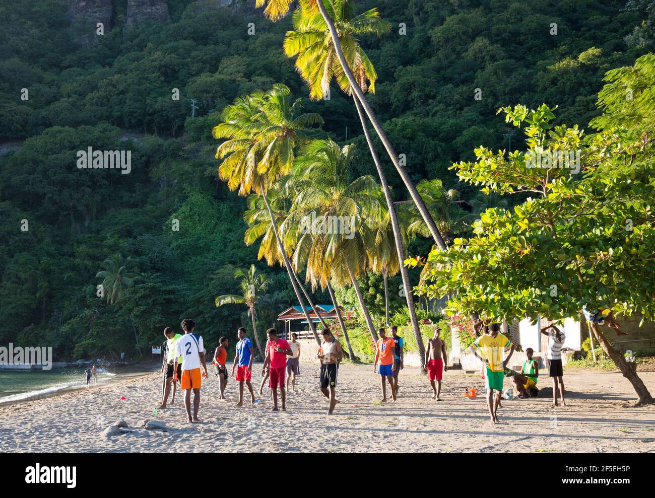 Soufriere, St Lucia. Local boys preparing for a football training session on the beach. Stock Photo