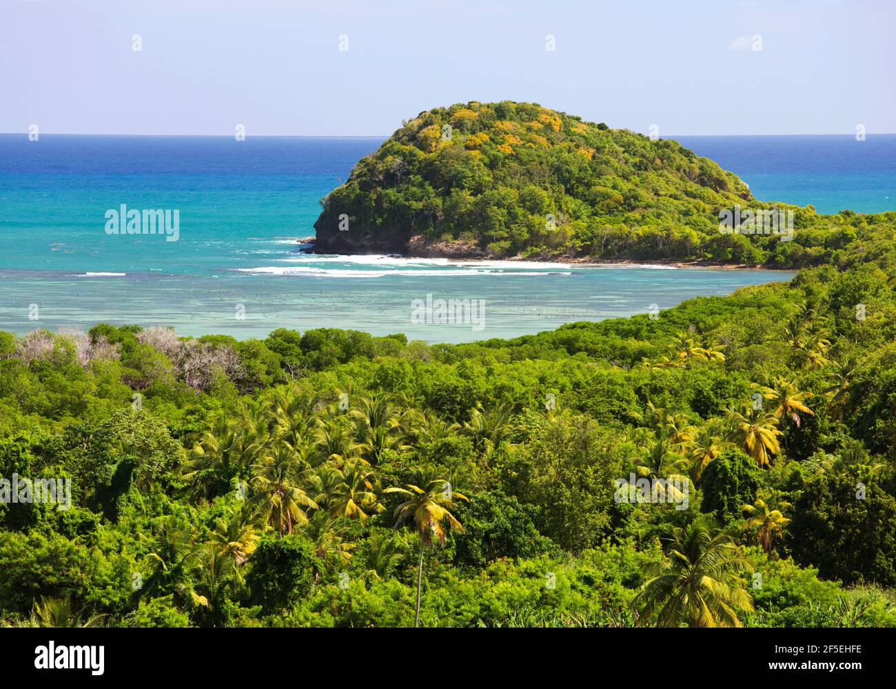 Mon Repos, Micoud, St Lucia. View over the stunning turquoise waters of the Atlantic Ocean from hillside viewpoint above Praslin Bay. Stock Photo