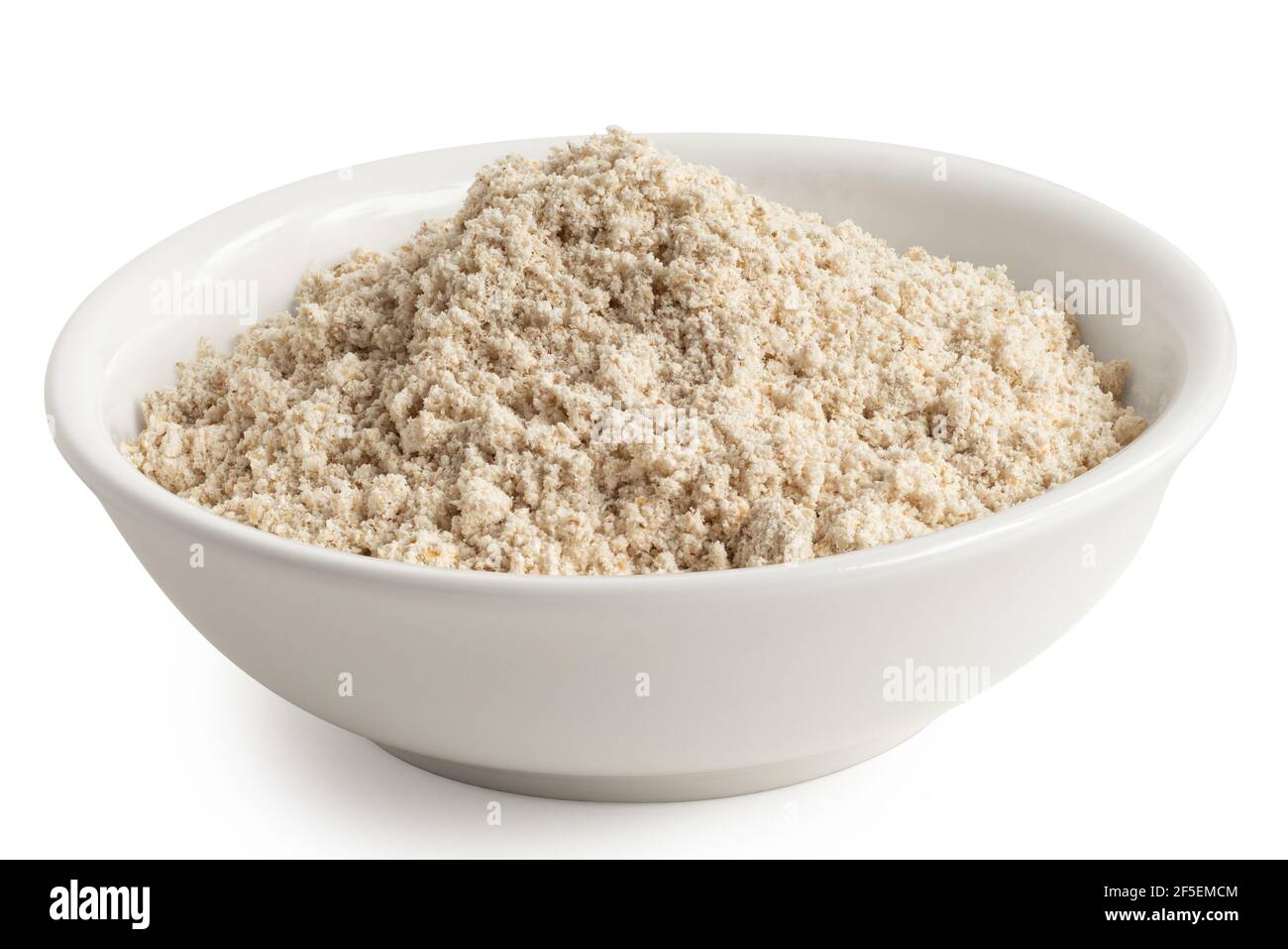 Oat flour in a white ceramic bowl isolated on white. Stock Photo