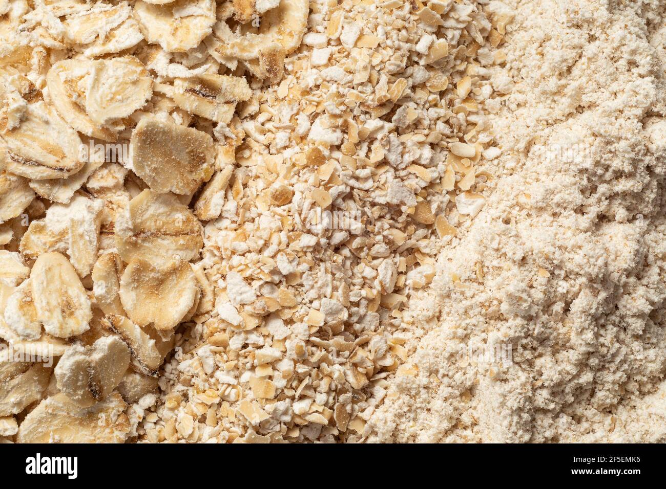 Uncooked porridge oats, oatmeal and oat flour. Top view. Background. Stock Photo