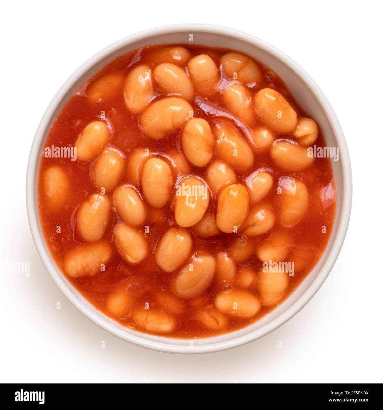 Baked beans in tomato sauce in a white ceramic bowl isolated on white
