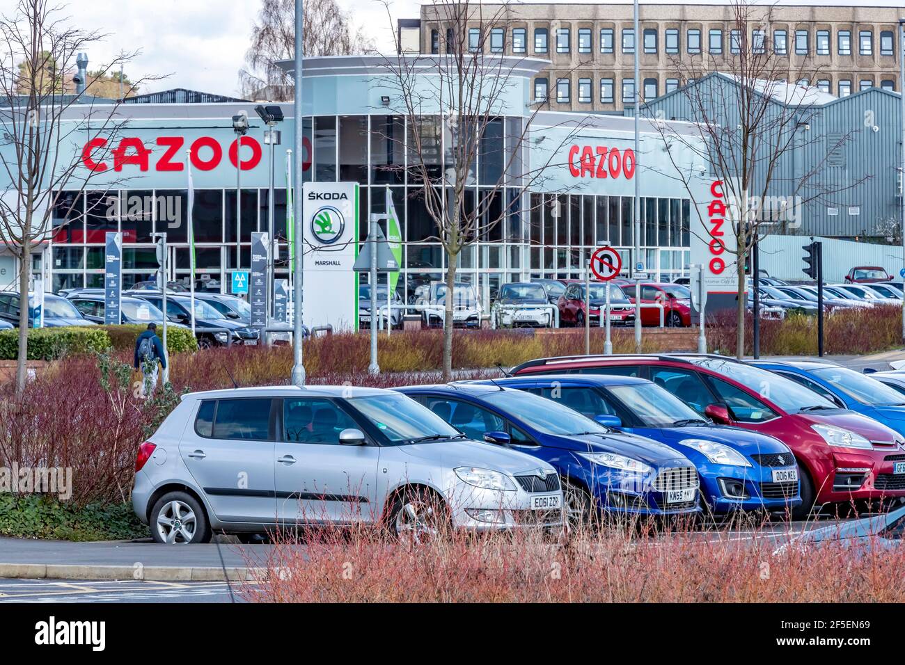 Cazoo car sales show rooms on the with cars in a public carpark on a bright warm sunny afternoon, Northampton, Stock Photo