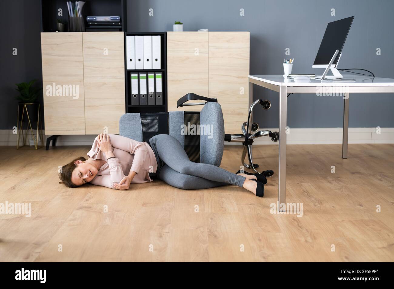 Slip Fall Office Chair Accident At Workplace Stock Photo Alamy