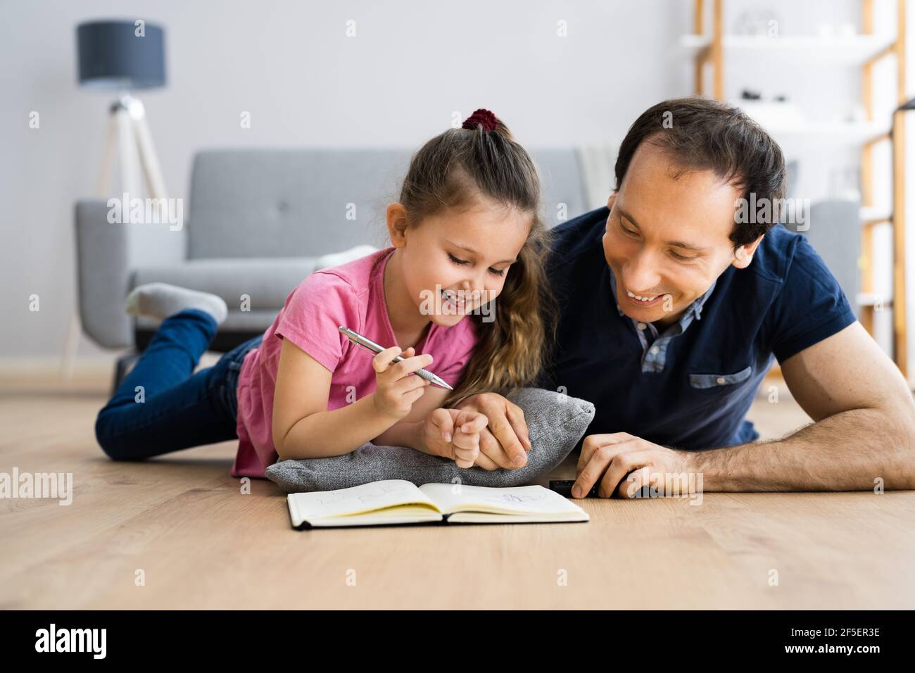 Creative Family Fun Together With Child Drawing Stock Photo