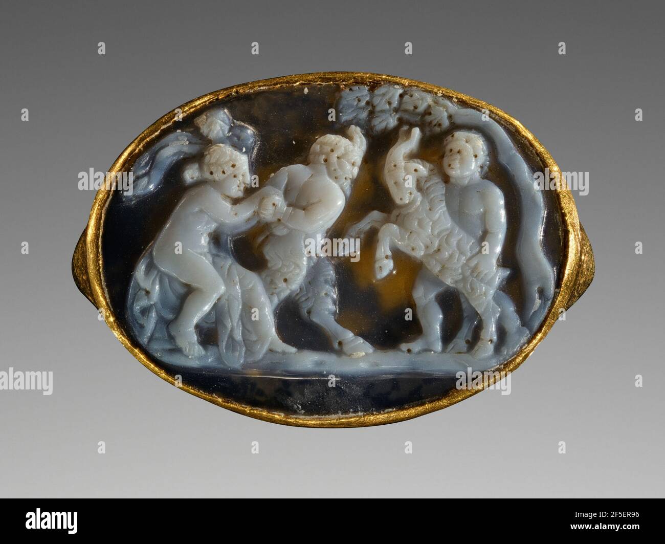 Cameo with Pan, a Maenad, a Satyr and a Goat inset Into a Ring. Attributed to Sostratos or Workshop (Greek ?, about 25 - 1 B.C.) Stock Photo