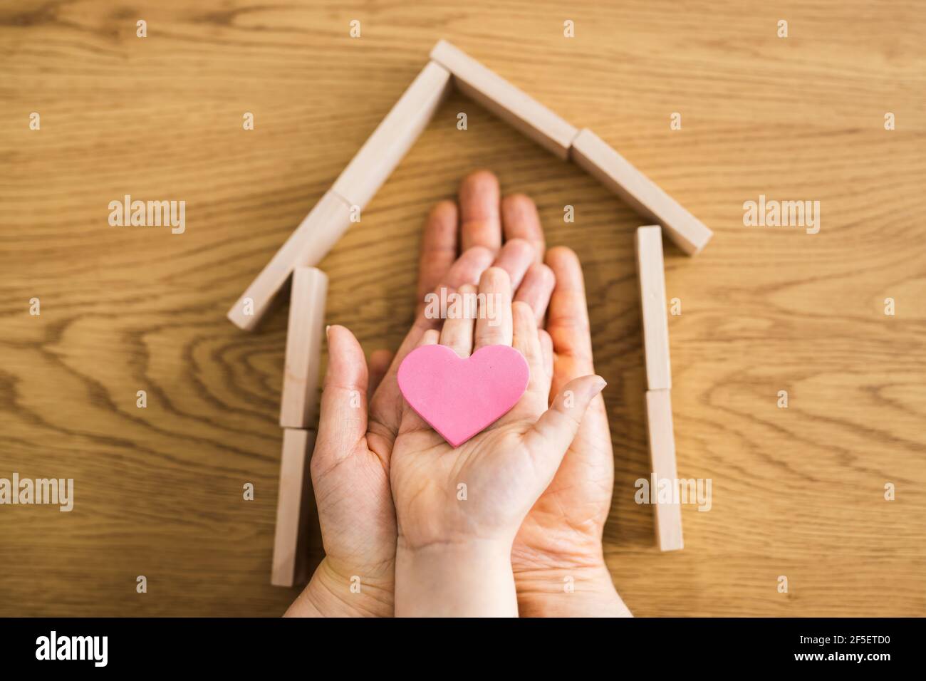 Family Home Real Estate Concept Holding Hands Stock Photo
