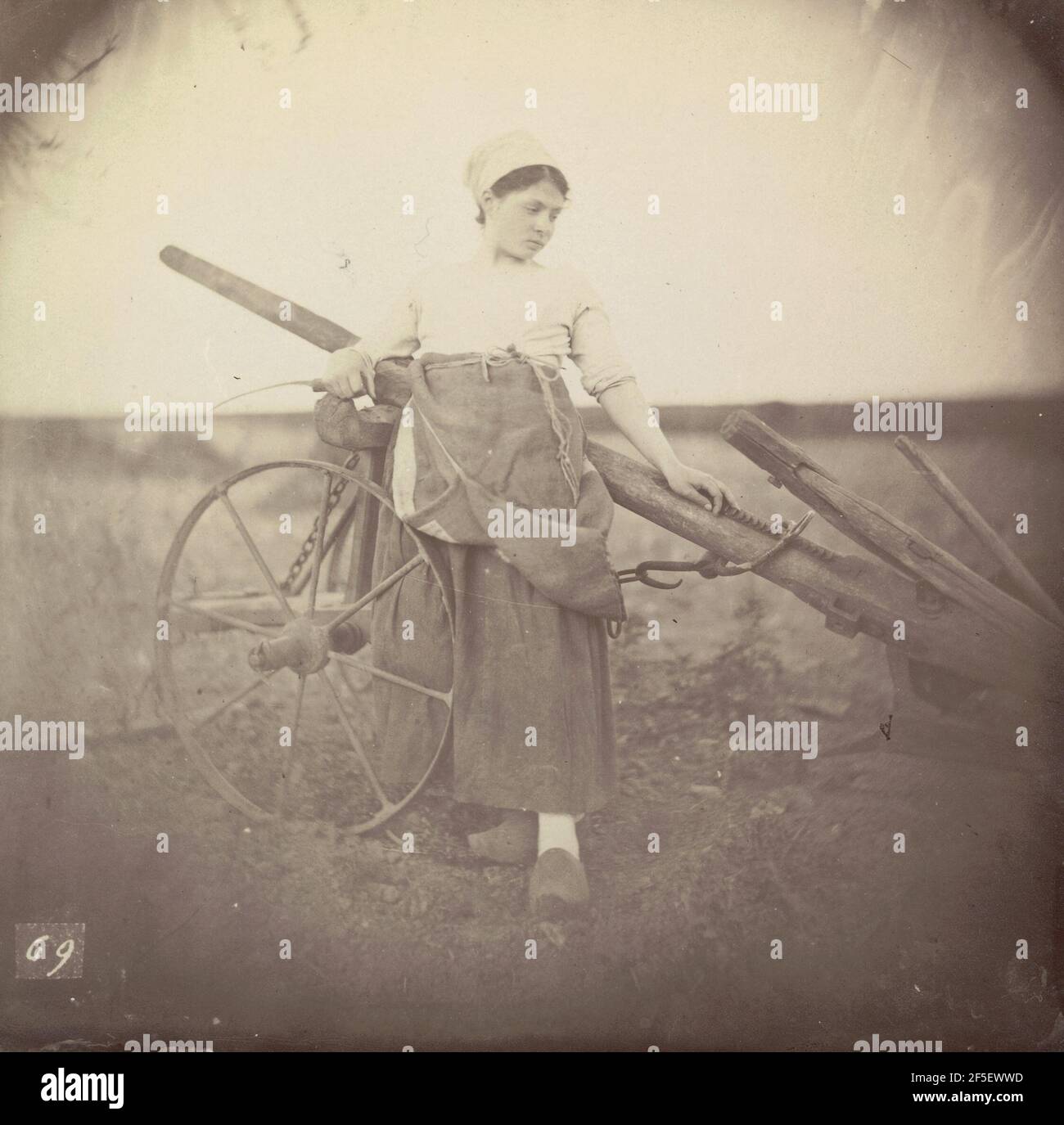 Young woman with plow. Unknown maker, "Giraudon's artist Stock Photo