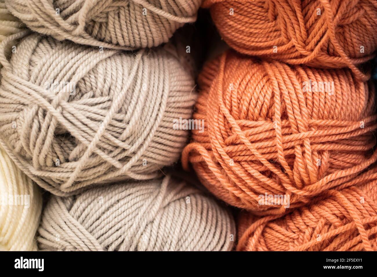 The texture of multi-colored fluffy woolen threads for knitting closeup ...