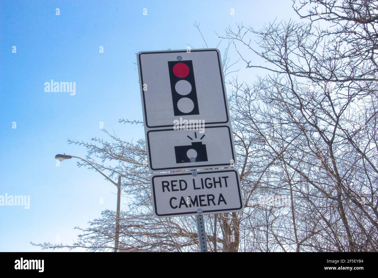 Red light camera sign Stock Photo