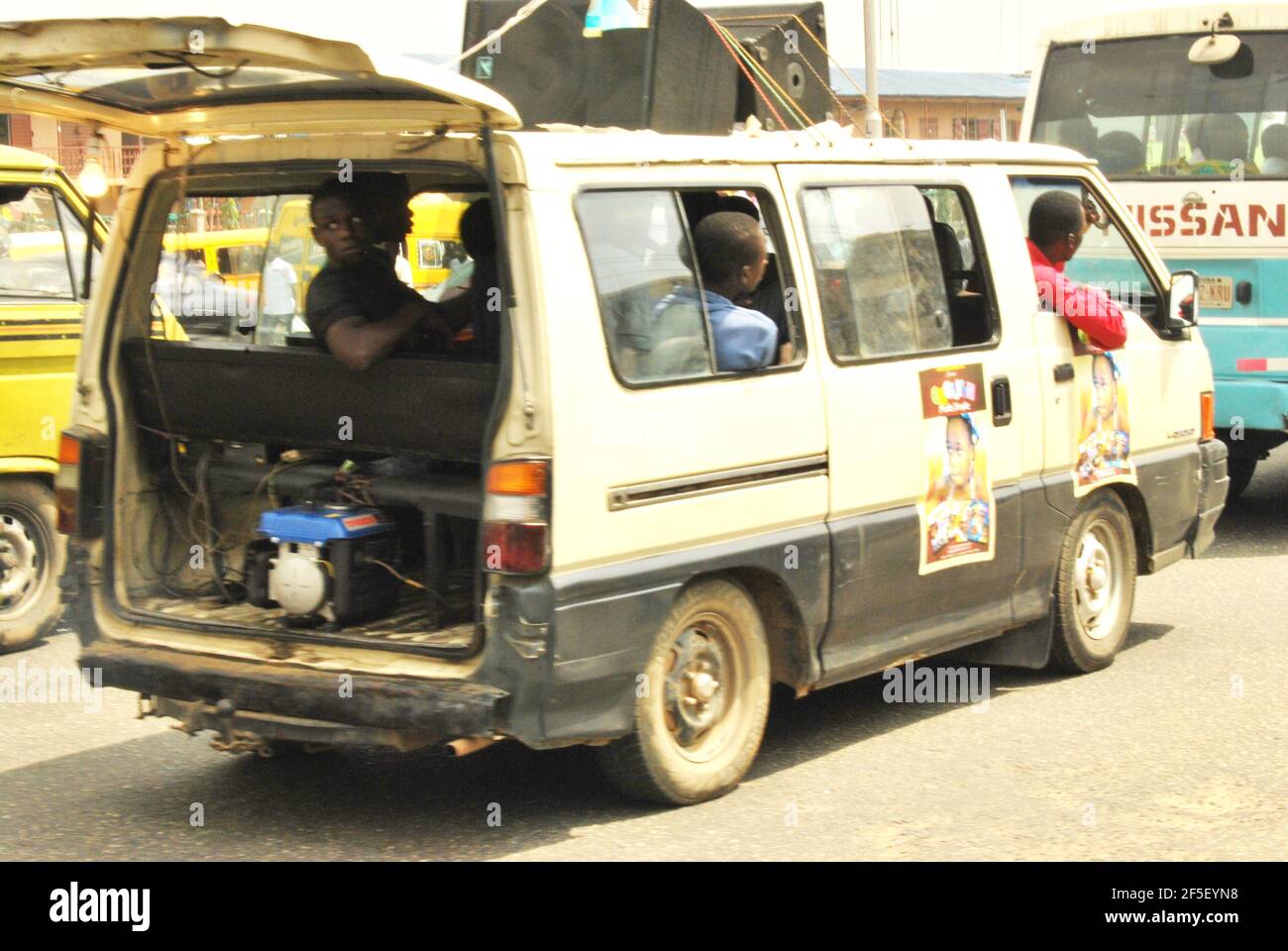 24. Lagos Metro: Mobile marketers using a generator set to power their speaker while promoting their product in Lagos, Nigeria. Stock Photo