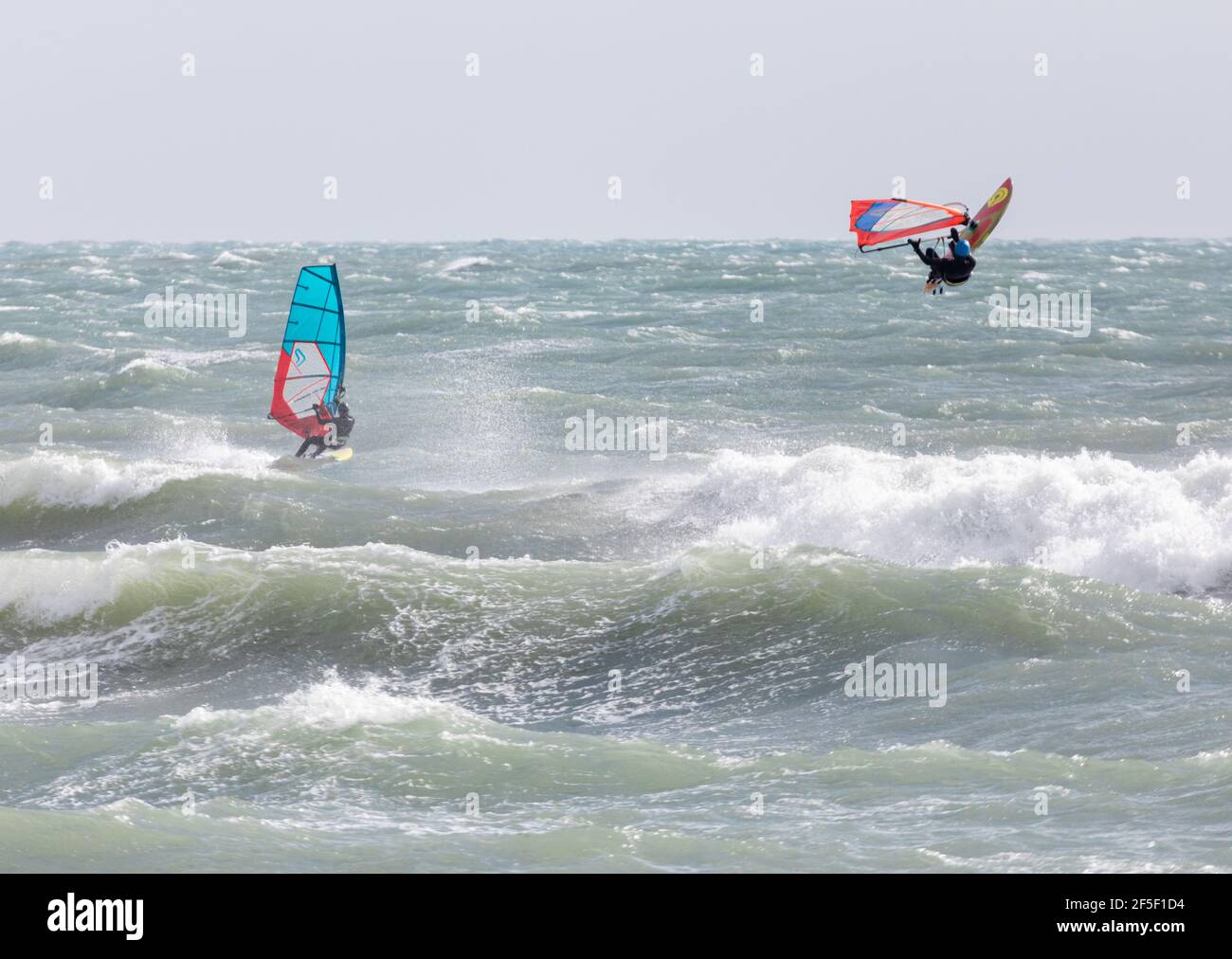 Garrettstown, Cork, Ireland. 26th Mar, 2021. Windsurfers taking advantage of the stormy conditions at Garrettstown, Co. Cork, Ireland. - Credit; Credit: David Creedon/Alamy Live News Stock Photo