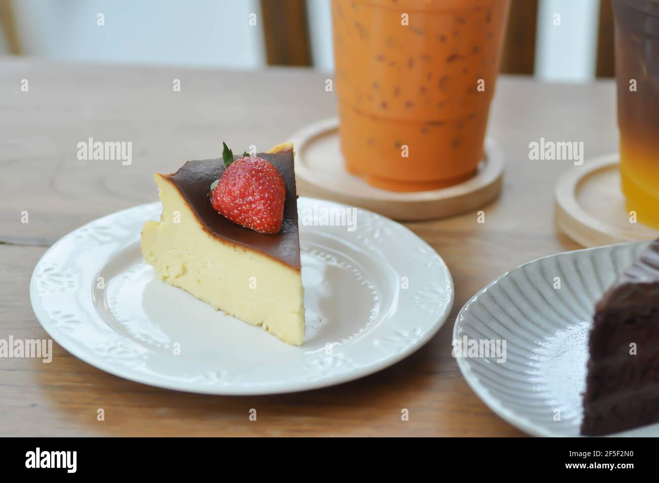 basque burnt cheesecake, burnt cheesecake with straberry topping Stock