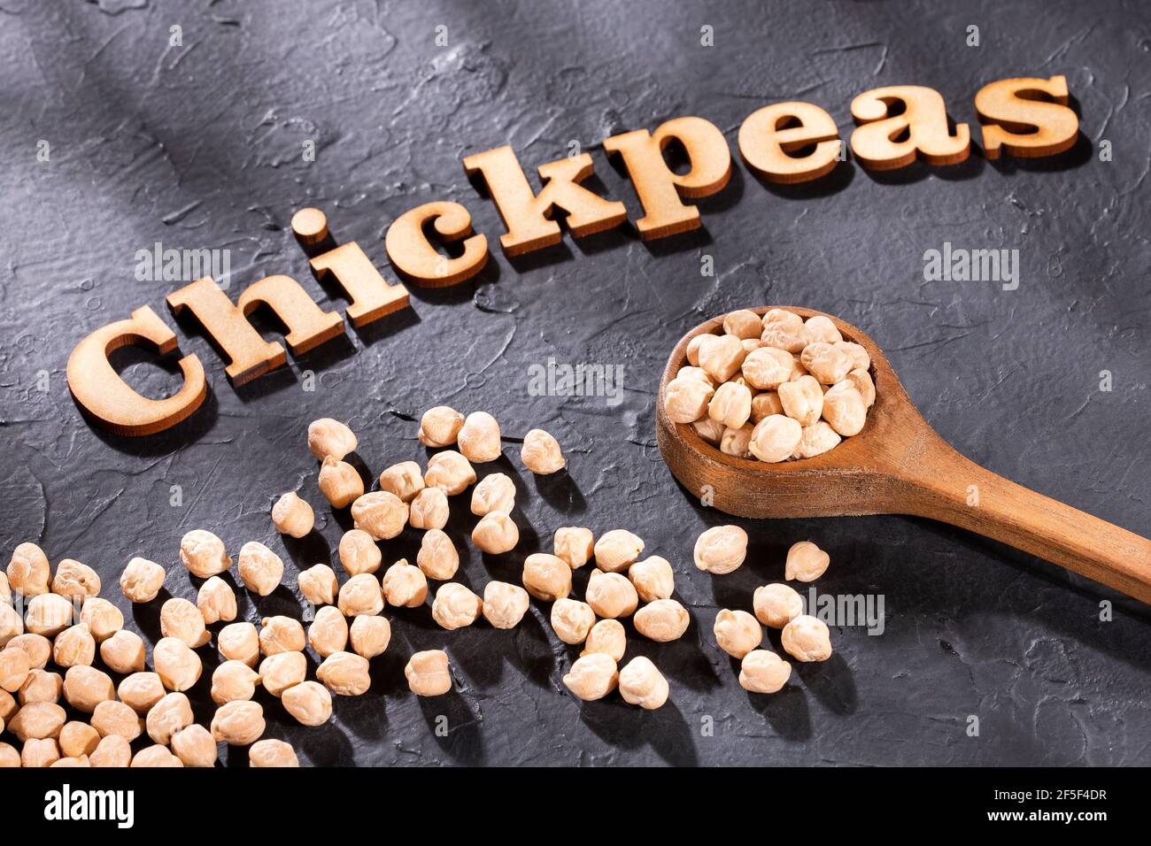 Chickpea phrase in wooden letters - Cicer arietinum Stock Photo